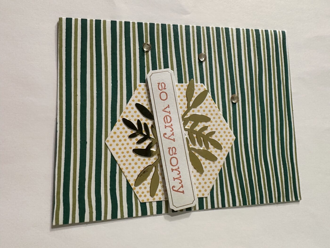 Green striped card with "so very sorry" sentiment strip