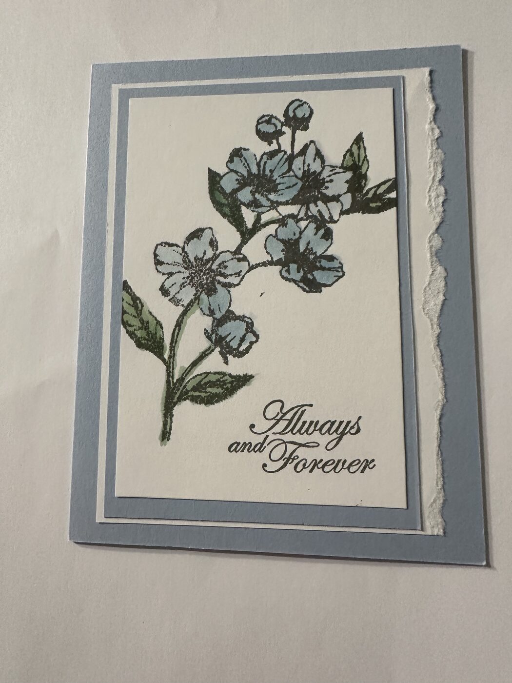 Soft blue floral card reading "Always and Forever"