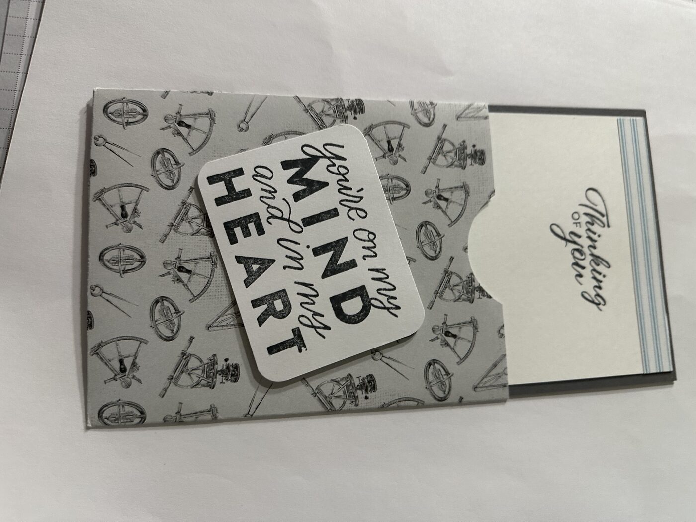 Grey patterned card reading "you're on my mind and in my heart"