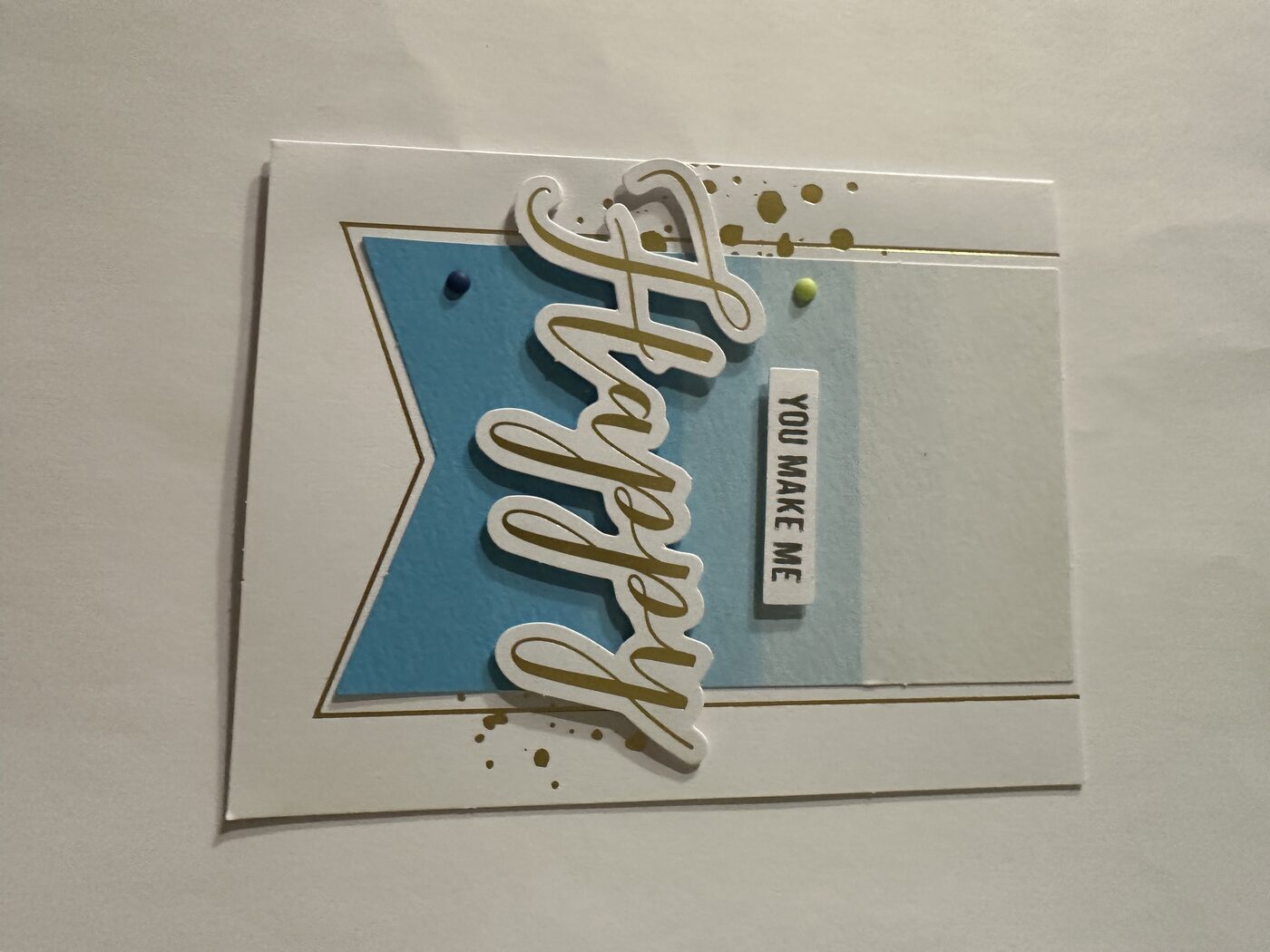 Blue banner card with layered "Happy" and "you make me" sentiment