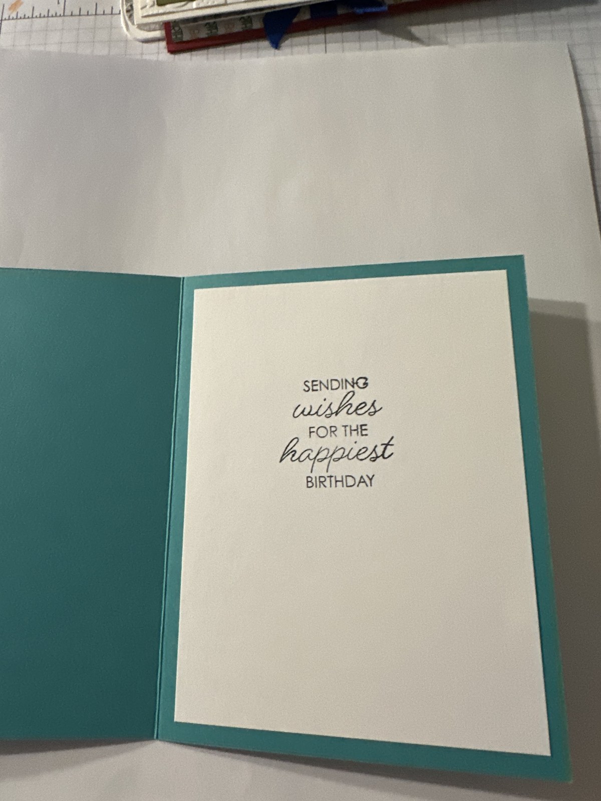 Inside of the card, stamped: Sending wishes for the happiest birthday